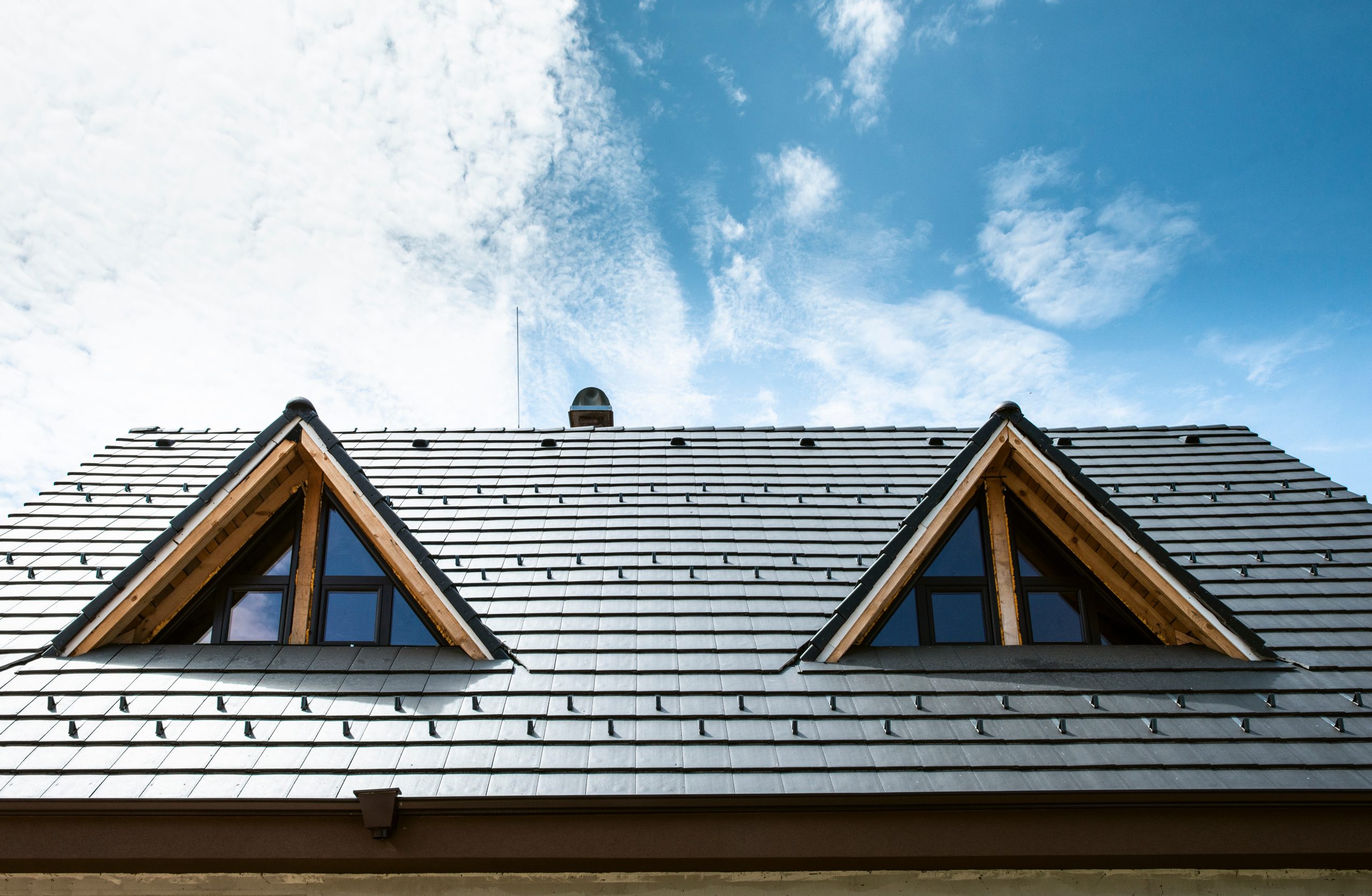 Laying roof tiles on new build house